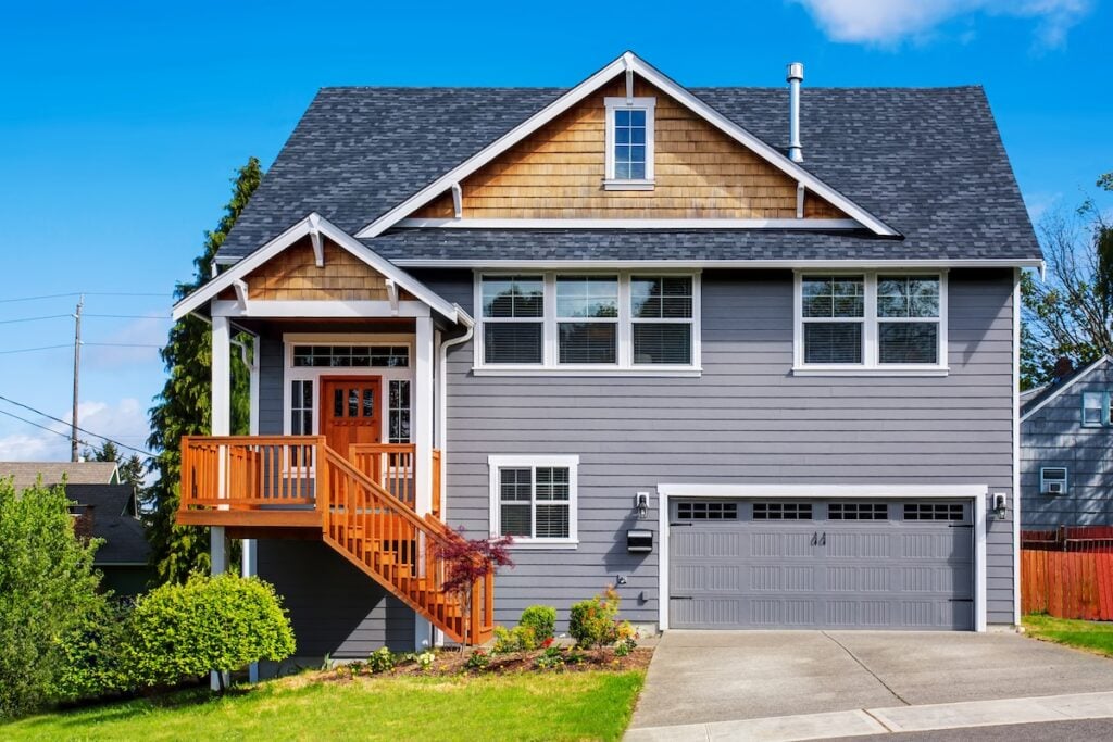 Luxurious gray house with white trim