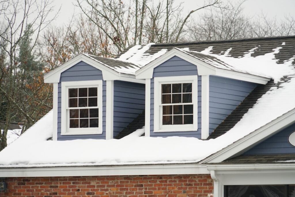 snow on roof of house