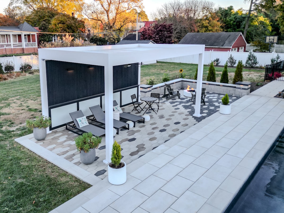 white pergola in the back yard