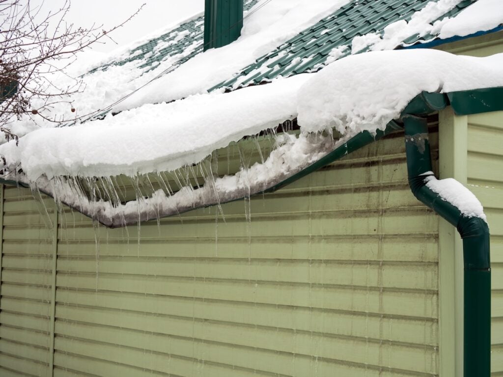 icicle on the house roof in winter season