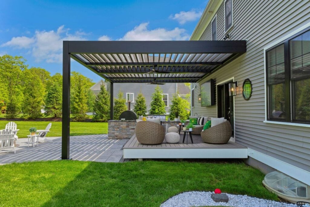 black pergola in a green backyard
