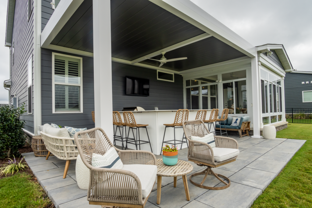 white and gray pergola and a cozy patio