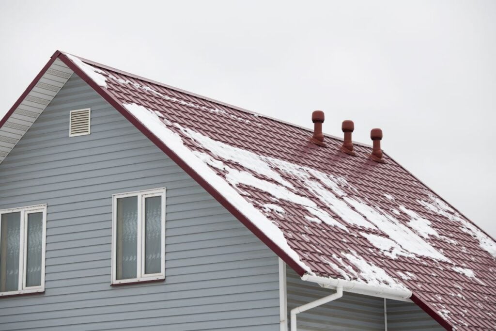 roof covered by melting snow