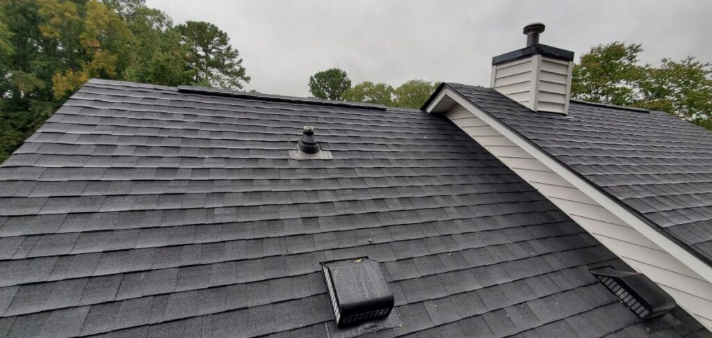 Newly Installed Black Asphalt Architectural Shingles on a Residential Home: Architecture, Roofing, Real Estate