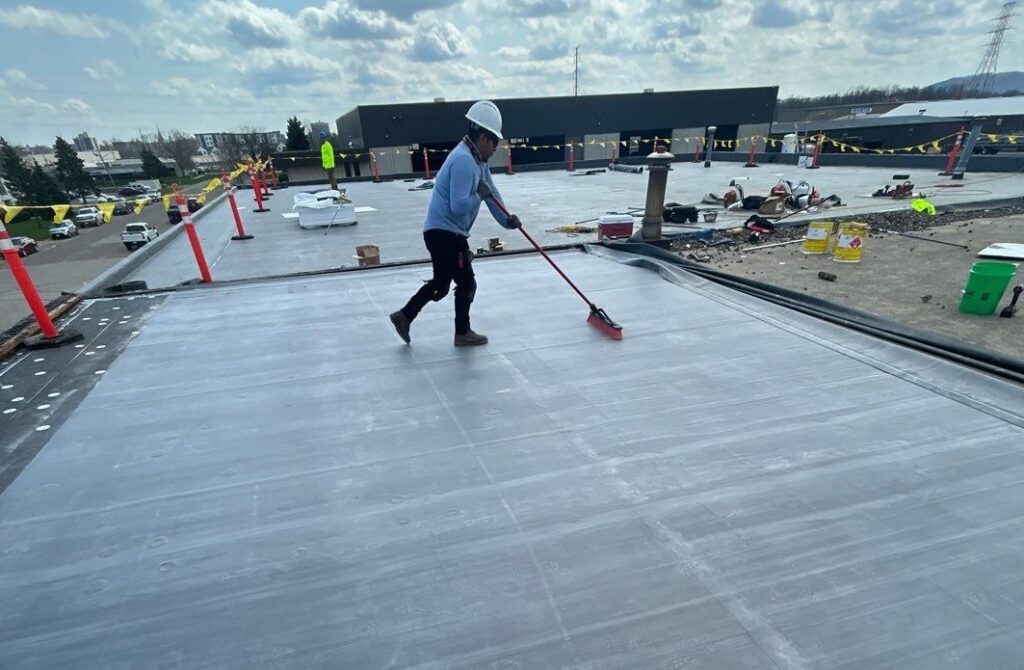 First american worker on commercial roof
