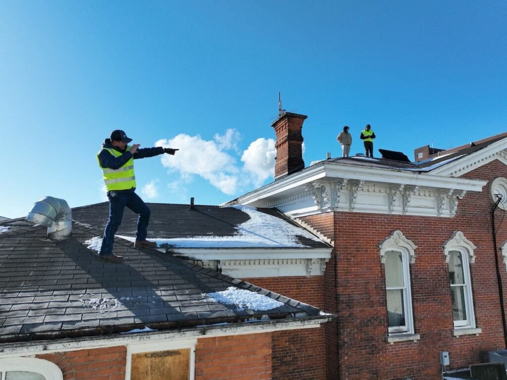 First American workers on commercial roof