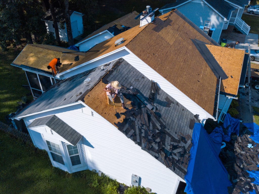 A Residential Roofing Crew In The Process Of Replacing A Roof Through Insurance Due To Storm Damage (Top Performer!)
