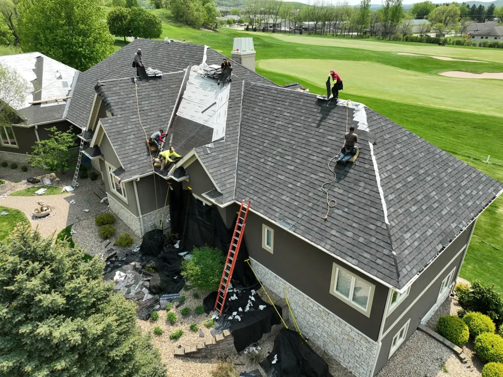 who provides emergency roof repair in  eau claire wi First america crew repairing shingles roof